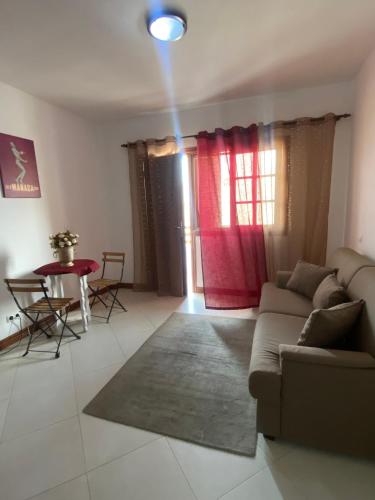 a living room with a couch and a table at Studio Manada Sal Rei in Sal Rei