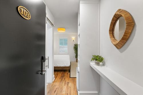 a hallway with a door leading to a bedroom at Marsh Hotel in New Orleans
