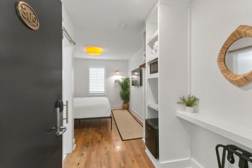 a hallway with a door leading to a bedroom at Marsh Hotel in New Orleans