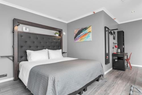 Postel nebo postele na pokoji v ubytování Hotel Aska