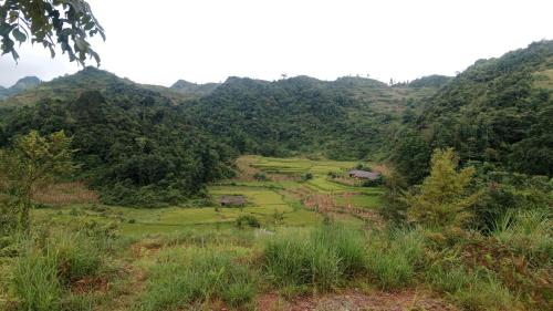 a view of a valley in the mountains at Higland Homestay Bac Ha in Bắc Hà