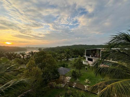 a view of the sunset from a house at U House Exclusive Retreat in Alor Gajah in Kampong Alor Gajah