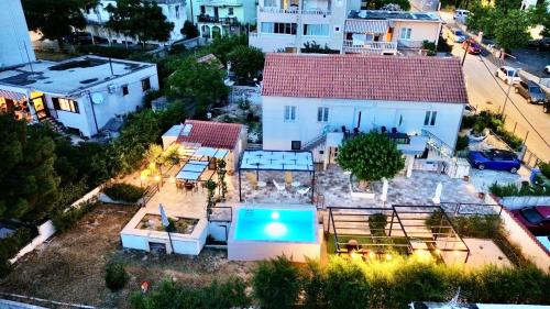 an aerial view of a house with a swimming pool at Summer Apartment in Makarska