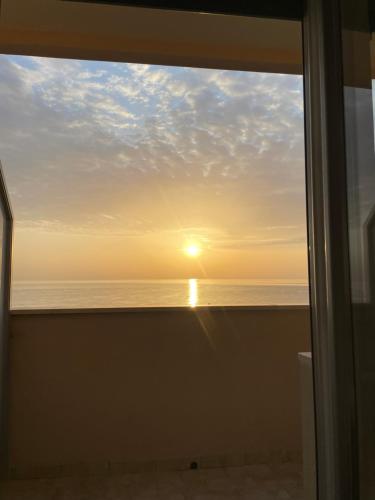 a view of the ocean from a window at Il balcone sul mare in Porto Recanati