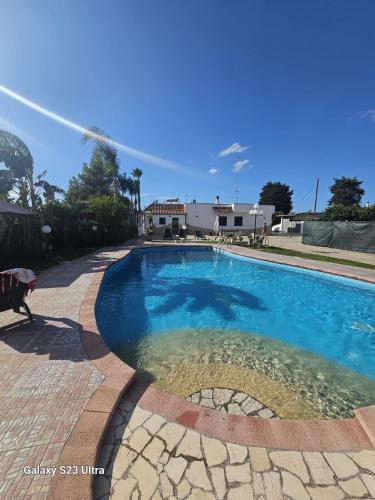 a swimming pool with a water sprinkler at Da Villa Assunta in Monteroni di Lecce