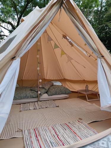 a canvas tent with two beds in it at Lilys Garden in Prebberede