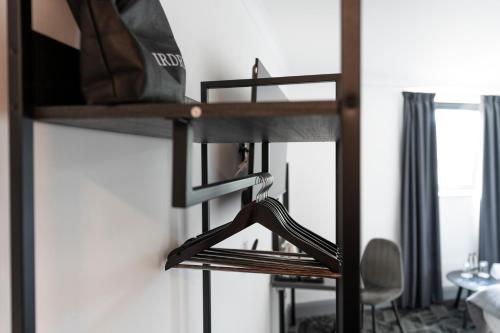 a room with a bunk bed with a bag on it at The Bolton Stadium Hotel, a member of Radisson Individuals in Bolton
