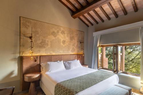 Postel nebo postele na pokoji v ubytování Borgo Dei Conti Resort Relais & Chateaux