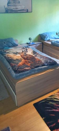 a bed in a room with at Monteur- und Ferienwohnung Waldrauschen in Fehrenbach