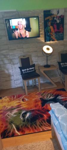 a living room with a rug on the floor at Monteur- und Ferienwohnung Waldrauschen in Fehrenbach