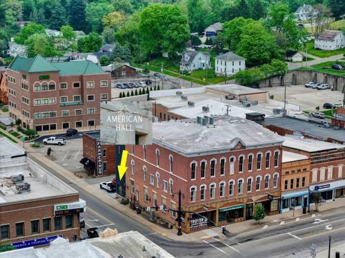 an aerial view of a town with buildings and a street at Clay St Suite in Millersburg