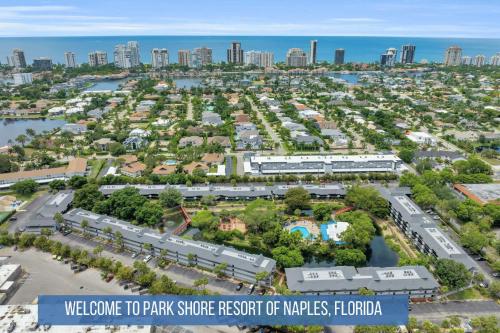 an aerial view of a park with a city at Corner Unit Updated And Near Lobby in Naples