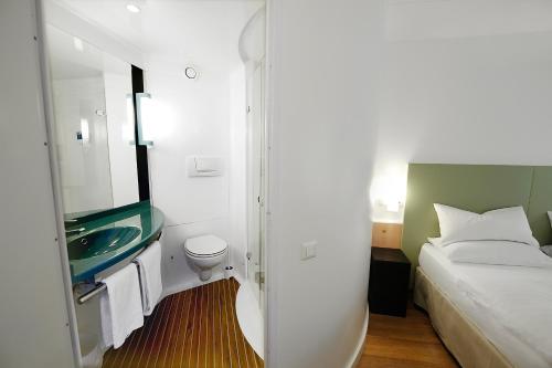 Letto o letti in una camera di Good Morning Kista
