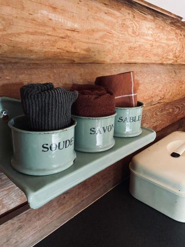 three bowls of yarn sitting on a shelf at Knus boomstamhuisje op de Schatberg - nabij Toverland in Sevenum