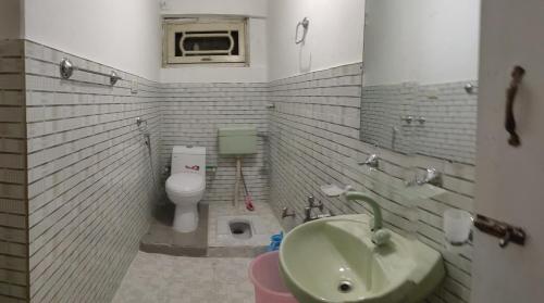 a small bathroom with a sink and a toilet at GOLDEN IBEX ReSOrT SKARDU in Skardu