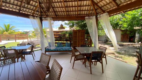 a patio with tables and chairs and a view of the ocean at Aloe Hotel Boutique in Prado