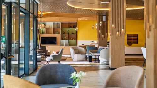 a lobby with chairs and a waiting room at Holiday Inn Tashkent City by IHG in Tashkent