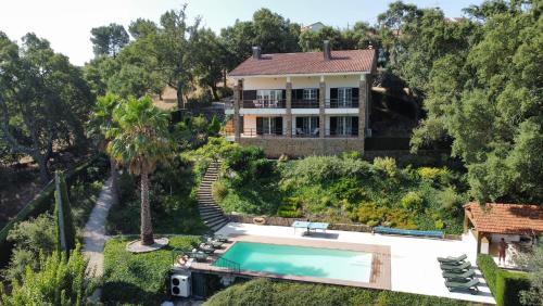 an aerial view of a house with a swimming pool at The Art House in Tomar
