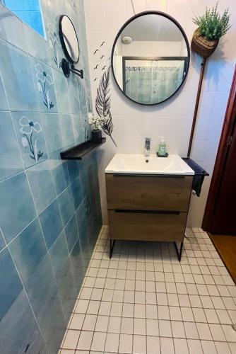 a bathroom with a sink and a mirror at Charme et confort en Isère in Saint-Siméon-de-Bressieux