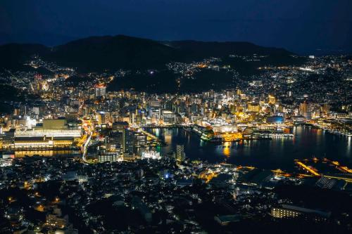 an aerial view of a city at night at Hotel Indigo Nagasaki Glover Street by IHG in Nagasaki