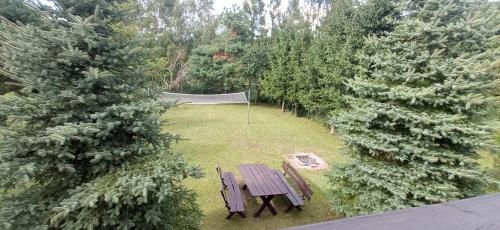 an overhead view of a park with a picnic table and trees at Kameralny Odpoczynek Nad Jeziorem in Bogaczewo