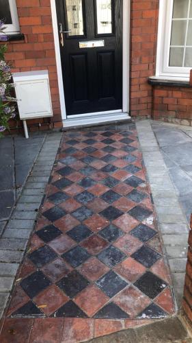 a front door of a house with a checkered floor at Maurice House 3 bedroom self catering townhouse in Bangor