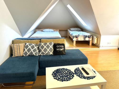 a living room with two beds and a couch at Maria Apartment Tolli põik in Kuressaare