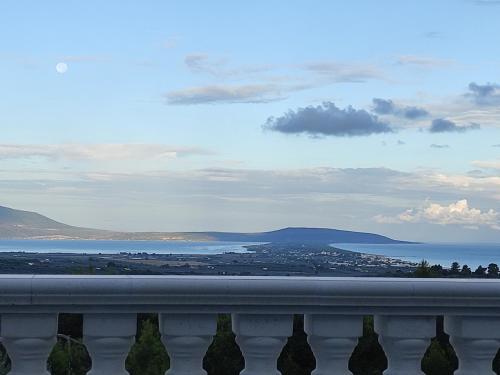 a view of the ocean from a balcony at Lunamora 2 in Rodi Garganico
