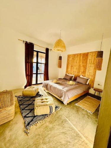 Ένα ή περισσότερα κρεβάτια σε δωμάτιο στο Magnifique Villa avec piscine