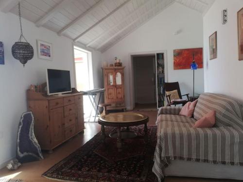 Et tv og/eller underholdning på Ferienhaus Finca Sonrisa