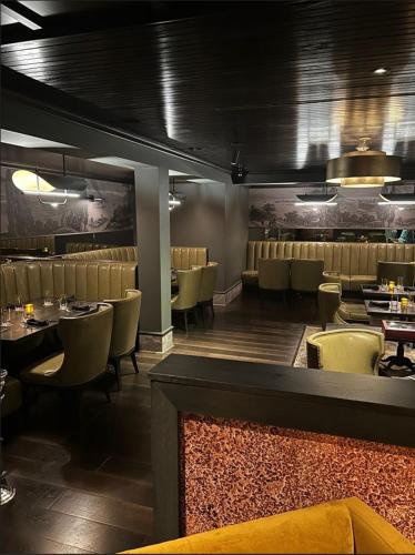 a dining room with tables and chairs in a restaurant at Oglebay Resort in Wheeling