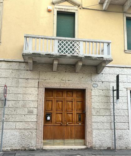 a balcony on top of a building with a door at TEZONE SEVEN Apartments in Verona