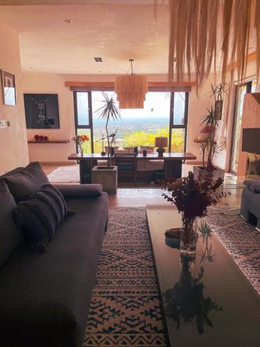 a living room with a couch and a table at Cuna del Cielo in San Miguel de Allende
