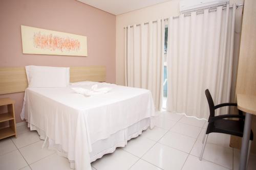 Una cama o camas en una habitación de Starbello Hotel