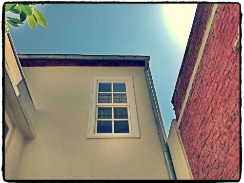 a white window on the side of a building at Maris Alsancak City Center in Konak