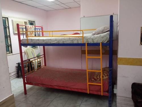 Postel nebo postele na pokoji v ubytování WISHTREE CORPORATE MENS DORMITORY FOR TECHIES AND Trainees