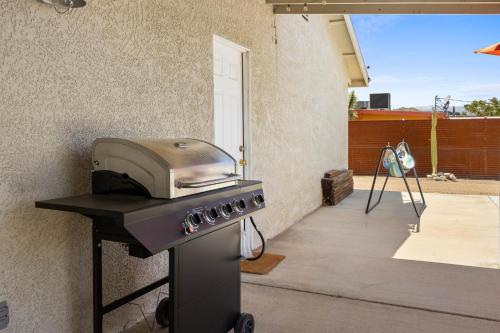 a grill with a toaster oven on a patio at Bonanza in the Desert - Pool, Hot Tub, Grill home in Yucca Valley