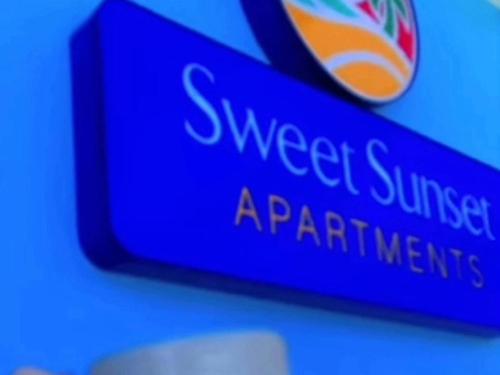 a blue sign that reads sovereign supplements appliances at Sweet Sunset 4 Playa Rompeolas, Aguadilla in Aguadilla