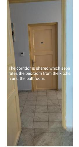 a room with a door and a tile floor at Ilio Socrates in Skala Marion