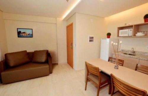 a living room with a couch and a table at S&F apartamentos em Salinas Park, Exclusive ou Premiun in Salinópolis