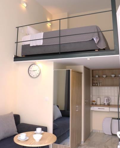 a small room with a bunk bed and a table at Piraeus Relax in Piraeus