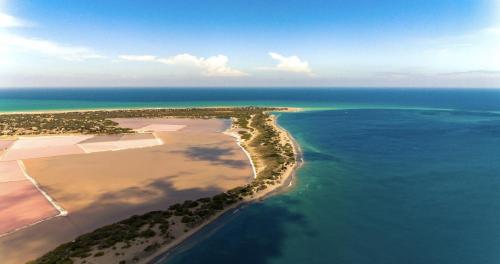 an aerial view of an island in the ocean at Luxury Beach Villa with Private Pool, Jacuzzi, Beach Club Access with Restaurant & Adventure Nearby in Baní