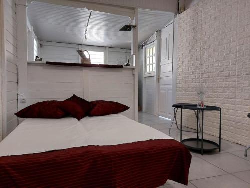 Postel nebo postele na pokoji v ubytování La Prairie, maison bois