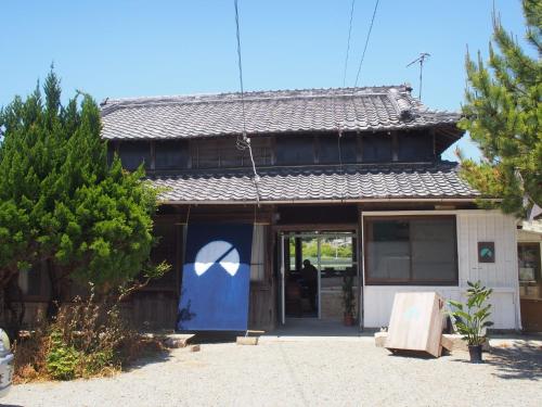 a house with a blue door in front of it at Nobinobi Biyori - Vacation STAY 59081v in Minamiawaji