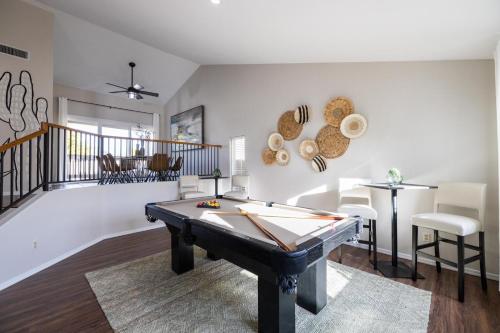 a living room with a pool table in it at Gilbert Comstock in Gilbert