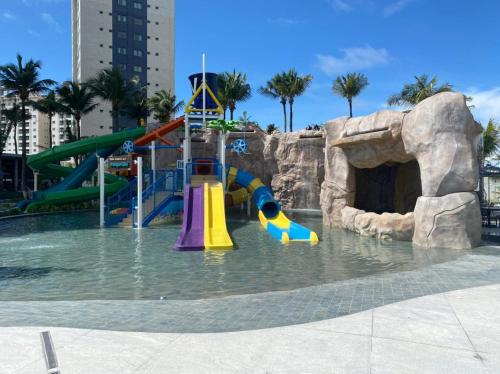 a water park with a slide in the water at S&F apartamentos em Salinas Park, Exclusive ou Premiun in Salinópolis
