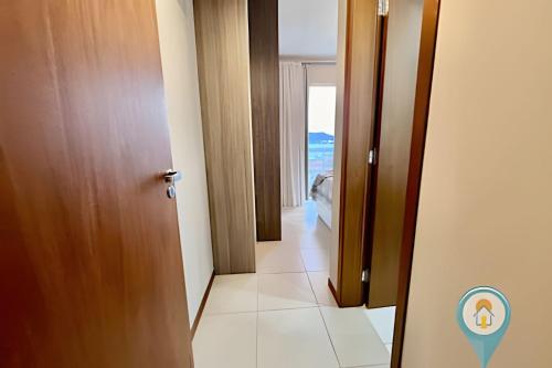 a corridor of a room with a door with a view at N1605 Vista Mar Nautilus Beto Carrero in Penha