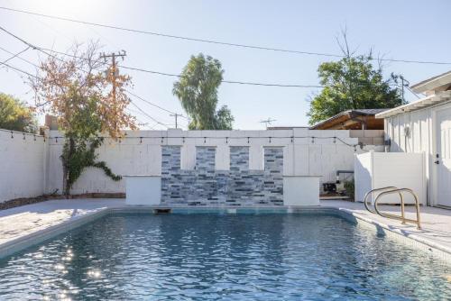 a swimming pool in the backyard of a house at Scottsdale Vernon in Scottsdale