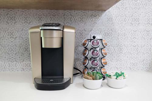 a coffee maker and two cups with sushi on it at Tempe Wesleyan in Tempe