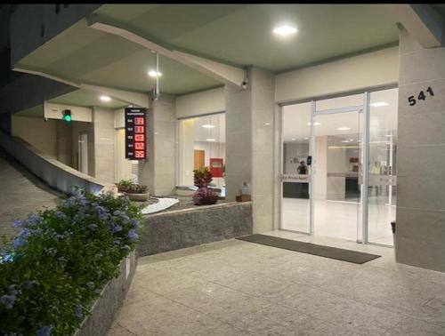 a lobby of a building with a entrance with a sign at AP confortável e bem localizado in Vitória